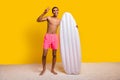 Full length photo of cheerful cool shirtless man holding floating matrass showing v-sign yellow color