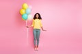 Full length photo of cheerful funky brunette hair mulatto girl hold many balons feel content have anniversary free time