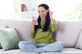 Full length photo of cheerful happy afro american raise fist winner hold hand phone indoors inside house home Royalty Free Stock Photo