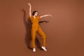 Full Length Photo Of Cheerful Joyful Woman Dance Enjoy Raise Hands Music Lover Isolated On Brown Color Background