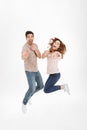 Full-length photo of cheerful loving couple in casual t-shirt an Royalty Free Stock Photo