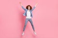 Full length photo of cheerful nice young woman jump up air smile active sportive isolated on pink color background Royalty Free Stock Photo