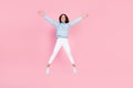Full length photo of cheerful overjoyed lady glad meeting you rejoice win sports competition yes hooray isolated on pink Royalty Free Stock Photo