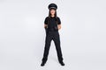 Full length photo of cheerful smile young happy police lad good mood wear uniform hat isolated on grey color background