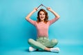 Full length photo crazy astonished girl sit floor legs crossed want rest relax put paperbook above head impressed scream Royalty Free Stock Photo