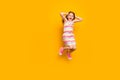 Full length photo of cute astonished child touching her head screaming shouting isolated over yellow background Royalty Free Stock Photo
