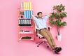 Full length photo of employee lawyer sit comfort chair hands hold behind head eyes closed free time break pink