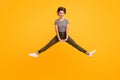 Full length photo of enthusiastic funky girl jump enjoy spring time move wear casual style clothes isolated over vibrant Royalty Free Stock Photo