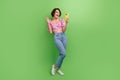 Full length photo of excited funky girl dressed print top video call modern device isolated green color background