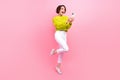 Full length photo of excited funky lady wear knitter pullover chatting instagram twitter telegram facebook isolated pink