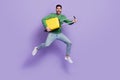 Full length photo of excited latin arab guy hold yellow baggage boarding plane wear stylish green look isolated on