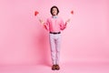 Full length photo of funny brunet hair cupid guy holding heart arrows isolated pink color background