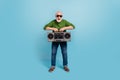 Full length photo of funny granddad hands hold boombox toothy smile isolated on blue color background