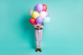 Full length photo of guy hide behind colorful hellium balloons formalwear yellow socks isolated teal color background