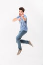 Full-length photo of handsome man 30s in casual t-shirt and jean Royalty Free Stock Photo