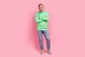 Full length photo of handsome senior man folded hands confident pose wear trendy green garment isolated on pink color Royalty Free Stock Photo
