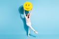 Full length photo of happy cheerful nice young woman big smile emoji raise above head isolated blue color background Royalty Free Stock Photo