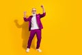 Full length photo of happy cheerful old man raise fists winner wear blue tuxedo isolated on yellow color background Royalty Free Stock Photo