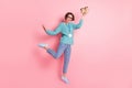 Full length photo of happy journalist woman raise coffee takeout good mood wear id isolated on pink color background