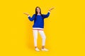 Full length photo of hispanic promoter girl in blue stylish jumper compare advantage language courses isolated on yellow Royalty Free Stock Photo