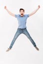 Full-length photo of joyous man 30s in casual t-shirt and jeans