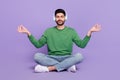 Full length photo of latin arab guy meditate listen classical music lotus pose wear stylish green look isolated on