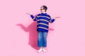 Full length photo of lovely senior lady look compare empty space dressed stylish blue striped garment isolated on pink Royalty Free Stock Photo