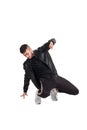 Full-length photo of a funny guy dancing in studio isolated on white background. Royalty Free Stock Photo