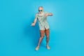 Full length photo of old aged gray bearded man senior wear stylish outfit dancing good mood beach discotheque isolated