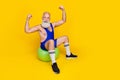 Full length photo of old funny grandfather bearded sitting wear blue sportswear showing hands up strong power muscles