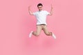 Full length photo of overjoyed dude man rejoice holiday weekend imagine can fly butterfly empty space isolated on pink Royalty Free Stock Photo