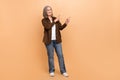 Full length photo pensioner woman white hair wearing brown stylish shirt point fingers novelty banner ad isolated on