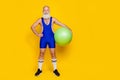 Full length photo of posing funny grandfather hold green acrobatic ball nice sportsman empty space promo equipment