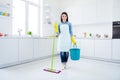 Full length photo of positive confident woman housewife hold bucket mop ready clean room floor disinfect covid-29