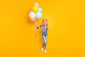 Full length photo positive inspired kid hold helium air baloons look copyspace think thoughts decide who gave Royalty Free Stock Photo