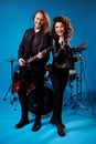 Full length photo positive two people rock band man play bass guitar woman sing song mic composition have world tour Royalty Free Stock Photo