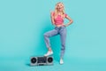Full length photo of positive young woman rock sign fingers cool boombox music isolated on teal color background