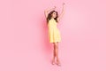 Full length photo of pretty person dancing look empty space have great time isolated on pink color background