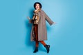 Full length photo of pretty traveler lady walk street good mood day lucky trip abroad wear casual long grey coat scarf