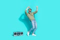 Full length photo of 90s atmosphere discotheque dancer funny man wear pullover  blue color background Royalty Free Stock Photo