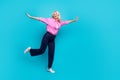 Full length photo of senior lady hands wings fly dancing wear trendy smart casual garment isolated on cyan color Royalty Free Stock Photo