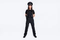 Full length photo of serious brave young policewoman stand hands behind back wear hat isolated on grey color background