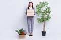 Full length photo of serious unhappy worker dismissed lady financial crisis lost work hold carton box stuff fired quit