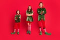 Full length photo of stylish trendy santa helper hold hands crossed advert xmas isolated on red color background