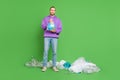 Full length photo of warn guy hold earth plastic bag litter lie floor recycle activist volunteer concept isolated over