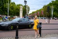 Full length photo of a well-dressed elegant young woman near the Buckingham Palace, London, England Royalty Free Stock Photo