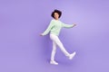 Full length photo of young dark skin woman walk good mood weekend isolated on violet color background
