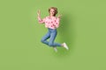 Full length photo of young jumping funky woman active showing double v-sign symbol peace wear pink shirt isolated on Royalty Free Stock Photo