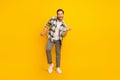 Full length photo of young man happy positive smile have fun dance party isolated over yellow color background Royalty Free Stock Photo