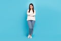 Full length photo of young pretty woman crossed hands standing smart  over blue color background Royalty Free Stock Photo